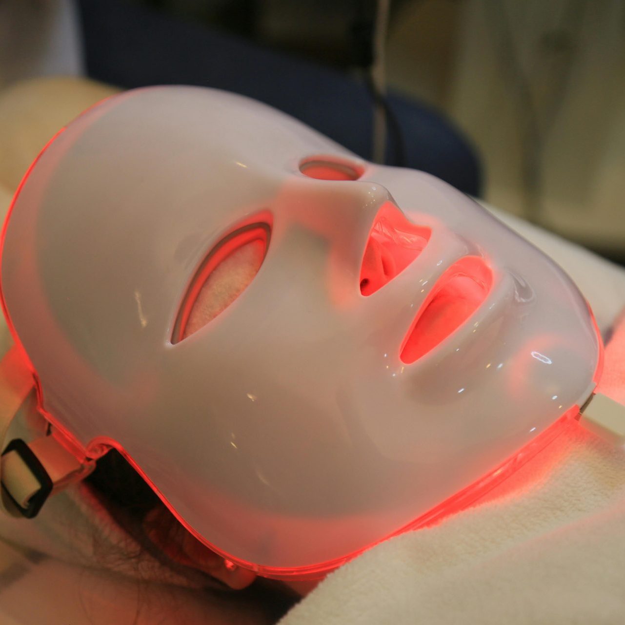 Close-up of a Person with an LED Face Mask On