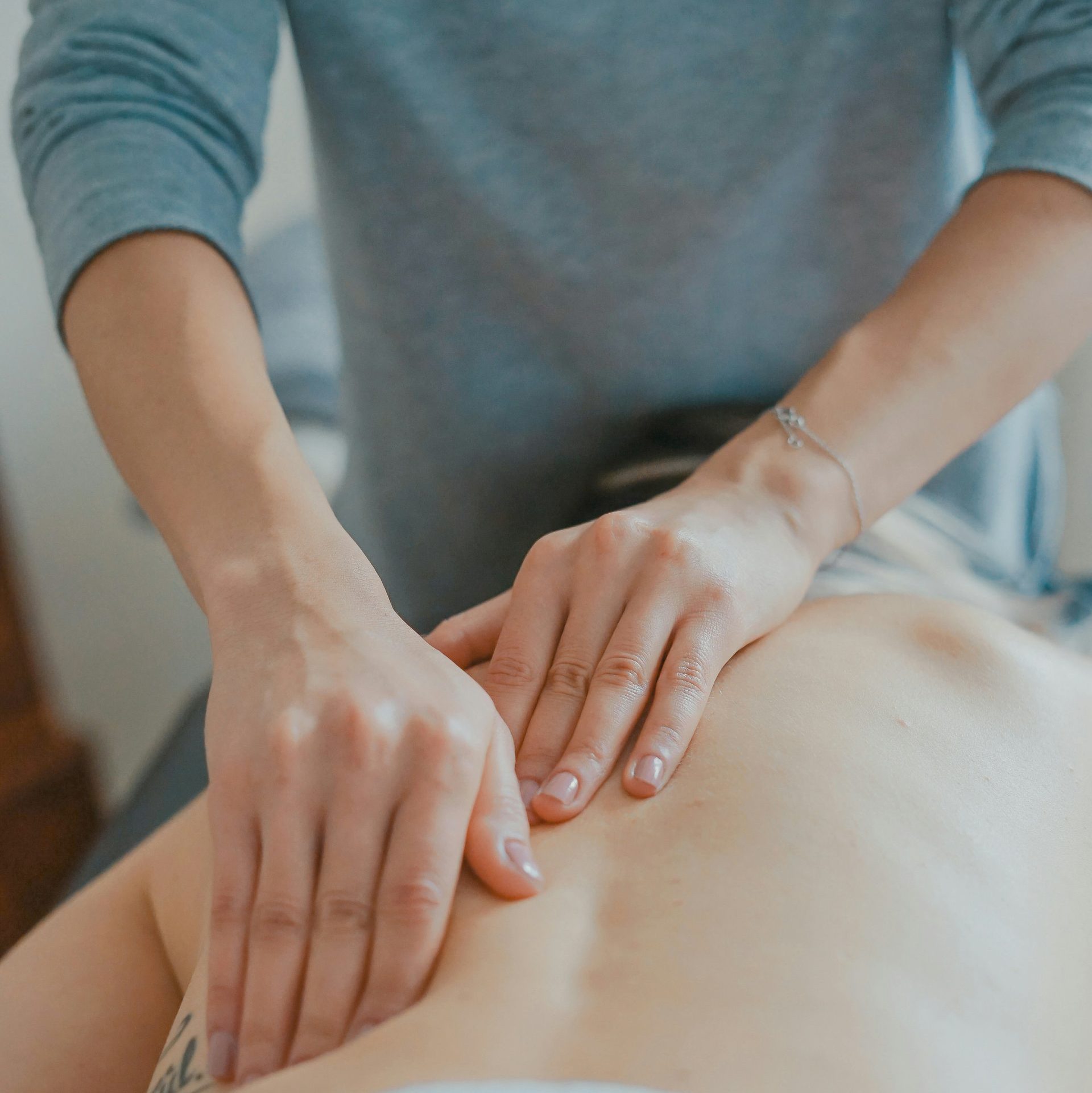 man massaging woman's body